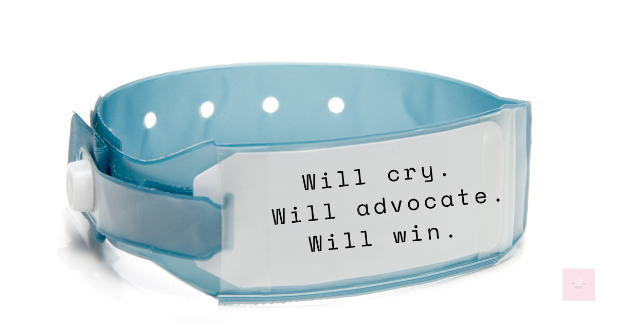 Close up of a hospital wristband against a white background. The text on the band reads: “Will cry. Will advocate. Will win.” A minimalist but powerful declaration of emotional strength and self-advocacy in a medical setting.